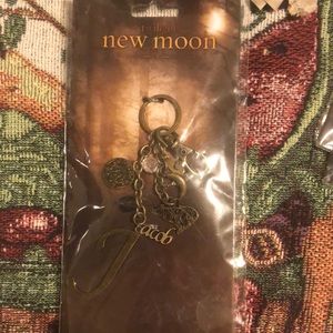 New moon “C” Twilight bag clip, brand new, never used, still in wrapper!!! Jacob